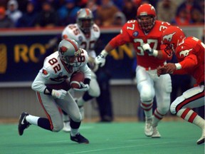 Darren Flutie makes a catch in front of Matt Finlay in the B.C. Lions' 1994 Western final win over the heavily favoured Calgary Stampeders.