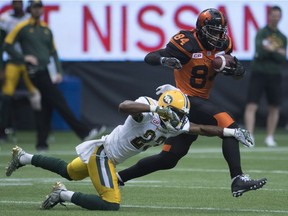B.C. Lions receiver Emmanuel Arceneaux gets away from Edmonton Eskimos defensive back Marcell Young. If he catches five balls on Saturday, Arceneaux will become the first Lions receiver to record 100 catches in a season since Geroy Simon in 2006.
