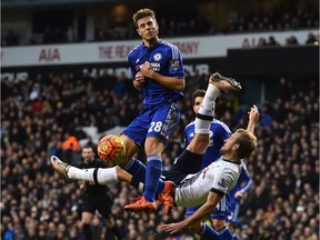 Tottenham Hotspur's English striker Harry Kane (R) attempts an overhead kick by Chelsea's Spanish defender Cesar Azpilicueta during the English Premier League football match between Tottenham Hotspur and Chelsea at White Hart Lane in north London on November 29, 2015.
