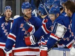 Michael Grabner, who leads the New York Rangers in goals this season, celebrates with teammates after completing his hat trick against the Tampa Bay Lightning on Oct. 30, 2016 in New York City.