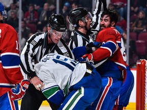 Derek Dorsett gets roughed up by the Habs' Greg Pateryn.