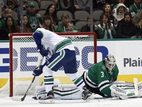 Vancouver Canucks' Jayson Megna (46) scores on Dallas Stars goalie Antti Niemi (31) during the first period of an NHL hockey game, Friday, Nov. 25, 2016, in Dallas.