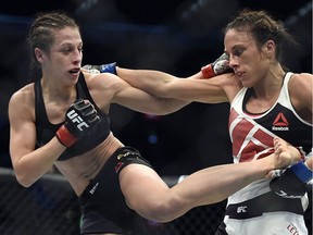 Joanna Jedrzejczyk, left, fights Valerie Letourneau during their UFC 193 straw-weight title fight in Melbourne on Nov. 15, 2015.