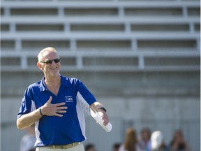 Seaquam head football coach Jerry Mulliss enjoys a light moment Sept. 9 by touching his heart in his first game back following sextuple bypass heart surgery in July.