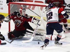 Goalie David Tendeck of the Vancouver Giants makes the save on Egor Babenko (22) of the Lethbridge Hurricanes during a WHL game at the Langley Events Centre on Nov. 5.