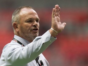 Canada head coach Mark Anscombe gives instructions to his players as they warm up before a rugby test match against Japan in Vancouver, B.C., on Saturday June 11, 2016.