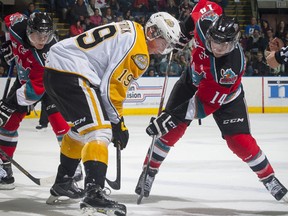 Rourke Chartier (r) of the Kelowna Rockets faces off against Nolan Patrick (l) of the Brandon Wheat King in an Oct 25, 2014 game.