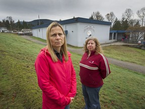 Tara Tait (left) with Diane Currie Sam in front of Irvine Elementary in Port Coquitlam. 'I feel like teachers are at the breaking point,' says Tait. 'I don’t want to see my kids in the education system today. I want to see change.'