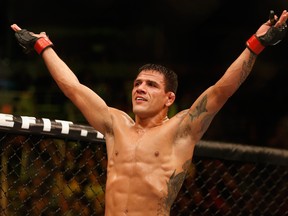 PHOENIX, AZ - DECEMBER 13:  Rafael dos Anjos celebrates his victory by unanimous decision over Nate Diaz (not pictured) in their heavyweight bout during the UFC Fight Night event at the at U.S. Airways Center on December 13, 2014 in Phoenix, Arizona.  (Photo by Christian Petersen/Getty Images)