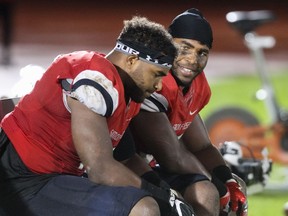 Justin Herdman, left, and Jordan Herdman have been tackling machines for the SFU Clan. The twins wrap up their collegiate football careers Saturday against Western Oregon at Swangard Stadium. Ron Hole/SFU athletics