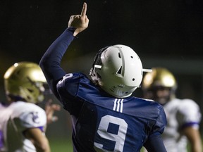 Notre Dame quarterback Steve Moretto points skyward Friday after rushing for 3 TDs and leading the Jugglers past Vancouver College at The Lakes. (PNG photo by Gerry Kahrmann)