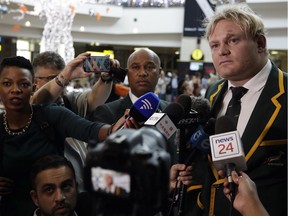 South Africa's rugby captain Adriaan Strauss, takes a question whilst talking to journalist upon their arrival at OR Tambo International Airport in Johannesburg, South Africa, Monday, Nov. 28, 2016. South African rugby is at its lowest point in years, maybe ever, and SA Rugby has ordered a review that will consider Coetzee's future as head coach but also the entire way the sport is governed.