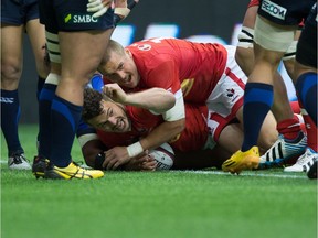 Taylor Paris, bottom, celebrates his try vs. Japan last June. He's one of several stars in Canada's XV to face Ireland on Saturday in Dublin.