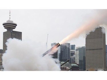 The skyline is seen as a cannon is fired off during the 21 gun salute during Remembrance Day celebrations in Vancouver, B.C. Friday, Nov. 11, 2016.