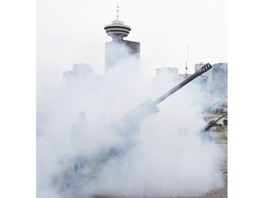 The Vancouver skyline is pictured through smoke as a cannon is fired off during the 21 gun salute during Remembrance Day celebrations in Vancouver, B.C. Friday, Nov. 11, 2016.
