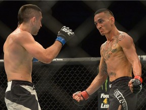 Max Holloway, right, will take on Anthony Pettis for the UFC interim featherweight title at UFC 206.