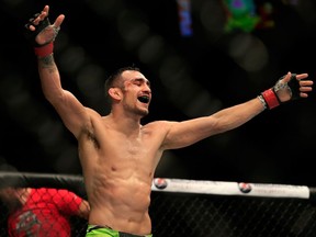 Tony Ferguson celebrates after defeating Abel Trujillo in their fight during UFC 181 in 2014.