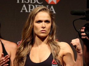 RIO DE JANEIRO, BRAZIL - JULY 31: UFC Strawweight Champion Ronda Rousey of the United States poses for photographers during the UFC 190 Rousey v Correia weigh-in at HSBC Arena on July 31, 2015 in Rio de Janeiro, Brazil. (Photo by Matthew Stockman/Getty Images)