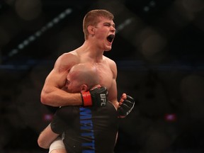 MELBOURNE, AUSTRALIA - NOVEMBER 15:  Jake Matthews of Australia celebrates victory over Akbar Arreola of Mexico in their lightweight bout during the UFC 193 event at Etihad Stadium on November 15, 2015 in Melbourne, Australia.  (Photo by Quinn Rooney/Getty Images)