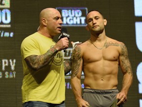 LAS VEGAS, NV - JULY 08:  Commentator Joe Rogan (L) interviews mixed martial artist Frankie Edgar after his weigh-in for UFC 200 at T-Mobile Arena on July 8, 2016 in Las Vegas, Nevada. Edgar will fight Jose Aldo for the interim UFC featherweight championship on July 9 at T-Mobile Arena.  (Photo by Ethan Miller/Getty Images)