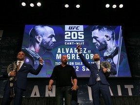 NEW YORK, NY - SEPTEMBER 27:  Conor McGregor (R) and Eddie Alvarez (L) face-off at the UFC 205 press conference at The Theater at Madison Square Garden on September 27, 2016 in New York City.  (Photo by Michael Reaves/Getty Images)