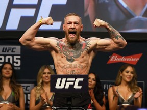 UFC Featherweight Champion Conor McGregor reacts during UFC 205 Weigh-ins at Madison Square Garden on November 11, 2016 in New York City.