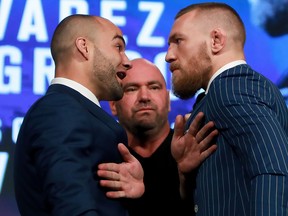 NEW YORK, NY - SEPTEMBER 27:  Conor McGregor and Eddie Alvarez face-off as UFC president Dana White breaks them up at the UFC 205 press conference at The Theater at Madison Square Garden on September 27, 2016 in New York City.  (Photo by Michael Reaves/Getty Images)