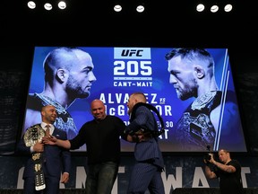 NEW YORK, NY - SEPTEMBER 27:  Conor McGregor and Eddie Alvarez face-off as UFC president Dana White breaks them up at the UFC 205 press conference at The Theater at Madison Square Garden on September 27, 2016 in New York City.  (Photo by Michael Reaves/Getty Images)