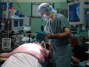 A doctor prepares a patient for laparoscopic bypass surgery.