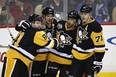 Pittsburgh Penguins&#039; Sidney Crosby (87) celebrates his goal with Phil Kessel (81), Trevor Daley (6), and Evgeni Malkin (71) in the second period of an NHL hockey game against the Arizona Coyotes in Pittsburgh, Monday, Dec. 12, 2016. (AP Photo/Gene J. Puskar)