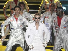 FILE - In this Nov. 10, 2013 file photo, Canada&#039;s pop star Justin Bieber performs in concert during his Believe world tour in Buenos Aires, Argentina. A court in Argentina indicted Bieber on Tuesday, Dec. 20, 2016 for allegedly sending his bodyguards to beat up a photographer in Buenos Aires three years ago. (AP Photo/DyN, Pablo Molina, File)