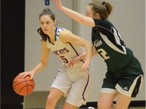 Brookswood's Louise Forsyth (left) scored a game-high 31 points Saturday to lead her team to a 72-60 win over Jessica Vidovic and Surrey's Lord Tweedsmuir Panthers in the semifinals of the Tsumura Basketball Invitational at the Langley Events Centre.