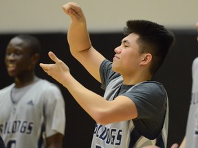 Byrne Creek Bulldogs (left to right) Abdul Bangura, Aaron Cruz and Shane Rafferty celebrate the school's TBI quarterfinal win over Burnaby South on Friday at the LEC. (PNG photo)