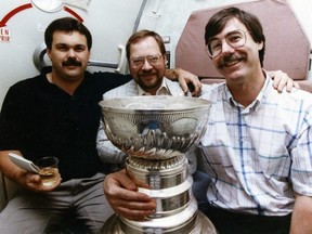 Ahhh, the golden days of journalism. Back when you could drink open liquor from a glass, right, Cam Cole? Our intrepid sports figurehead took time to pose with fellow Edmonton Journal writers Ray Turchansky, centre, and Jim Matheson and the Stanely Cup on their flight back to Edmonton in 1990 after the Oilers beat the Bruins in the Stanley Cup final.