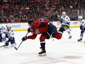 Alex Ovechkin follows his shot on goal in the second period against the Canucks.