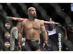 Demetrious Johnson reacts after defeating Tim Elliott during a mixed martial arts flyweight bout Saturday, Dec. 3, 2016, in Las Vegas.