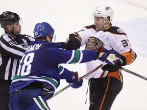 Vancouver Canucks' Nikita Tryamkin (88) grabs Anaheim Ducks' Nick Ritchie (37) during third period NHL hockey action in Vancouver on Friday, December 30, 2016.