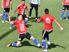 Paraguayan national team player Miguel Almiron, left, takes part in a training session at the Complejo Albiroga training centre in Ypane, Paraguay, on Nov. 14 ahead of a World Cup 2018 South American qualifier against Bolivia.