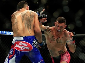 NEWARK, NJ - APRIL 18:  Cub Swanson punches Max Holloway in their featherweight bout during the UFC Fight Night event at Prudential Center on April 18, 2015 in Newark, New Jersey.  (Photo by Alex Trautwig/Getty Images)