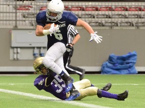 Notre Dame's Joshua Gabriele shows some Heisman form as he breaks the plane for a 20-yard touchdown Saturday morning in the Subway Bowl Grade 8 B.C. final against Vancouver College. (Howard Tsumura, PNG photo)