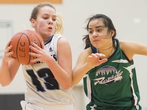 Seycove's Kayla Krug battled Riverside's Keimi Cuellar on Thursday in the opening round of the Tsumura Basketball Invitational at LEC. (Richard Lam, PNG photo)