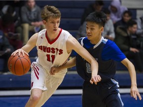 Lord Byng Grey Ghosts' Nathan Bromige drives the ball around Port Moody Blues' Stephen Feng Thursday at the Tsumura Basketball Invitational in Langley.