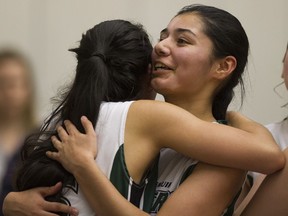 Lord Tweedsmuir's Shelvin Grewal (right) is congratulated by teammate Ali Norris after hitting winning shot last March in B.C. quarterfinal win over Riverside.