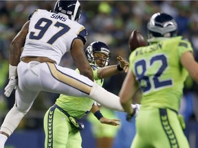 Quarterback Russell Wilson #3 of the Seattle Seahawks passes against the Los Angeles Rams at CenturyLink Field on December 15, 2016 in Seattle, Washington.