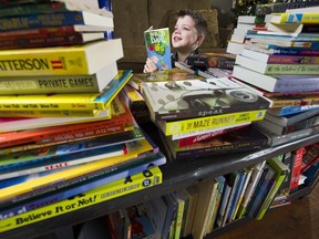 Reece Reichelt reads one of his favourite books. He has collected 253 books to donate to the Maple Ridge-Pitt Meadows Christmas Hamper Society.