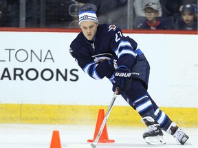 Nik Ehlers carries the puck around a pylon during the Winnipeg Jets annual skills competition at MTS Centre in Winnipeg on Fri., Dec. 16, 2016. Kevin King/Winnipeg Sun/Postmedia Network