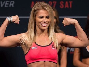 Paige VanZant, of Sacramento, Calif., poses during the weigh-in for a UFC Fight Night event in Vancouver, B.C., on Friday August 26, 2016.