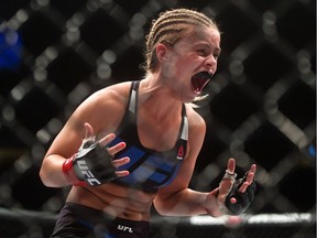 Paige VanZant celebrates after defeating Bec Rawlings during August's women's strawweight bout during a UFC Fight Night event in Vancouver.