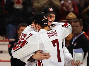 Justin Pogge and Steve Downie embrace after Canada defeated Russia to win the 2006 World Junior Hockey Championship in Vancouver.