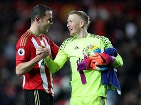 Sunderland goalkeeper Jordan Pickford (right, getting post-match congratulations from teammate John O’Shea) has been a key figure in his club’s recent success.